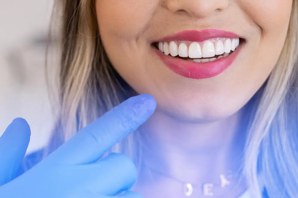cosmetic-dentist-pointing-womans-teeth