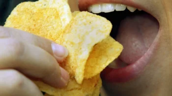 Starchy snacks and chips shown as foods that damage teeth and contribute to tooth decay