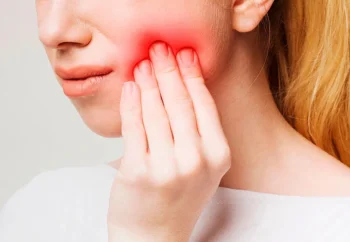Patient experiencing persistent toothache and throbbing pain as one of the signs you need to visit a dentist