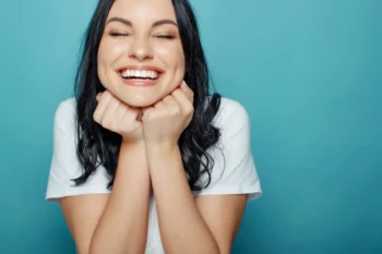 How a Full Smile Makeover Can Transform More Than Just Your Teeth 3 Patient smiling confidently after full smile makeover dental treatment at clinic