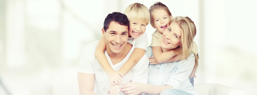 From Cleanings to Dental Implants: Complete Dental Services at Redeemed Smiles 30 Family receiving comprehensive dental care with complete dental services at clinic