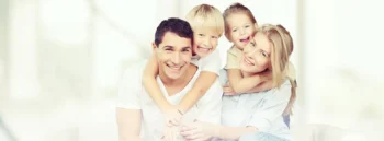 Family receiving comprehensive dental care with complete dental services at clinic