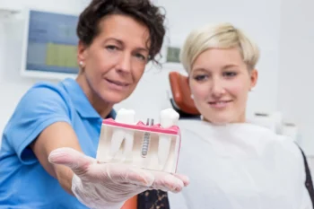 How Old Are Most People Who Choose Full-Mouth Dental Implants? (What the Research Really Shows) 4 Dentist explaining benefits of full-mouth dental implants for older patients