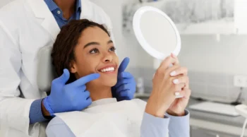 Self-conscious smile in photo before cosmetic Smile upgrade Yukon OK dental procedure