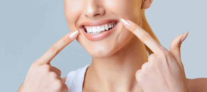 Patient smiling confidently after dental treatment learning to love your smile again