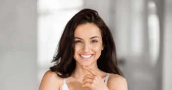 Patient smiling confidently after dental treatment, boosting confidence and helping them love your smile again