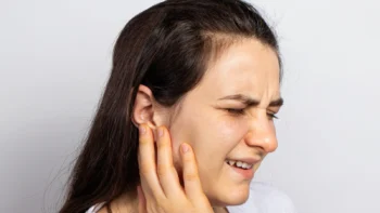 Patient experiencing jaw pain and headaches treated by dentist in Yukon OK