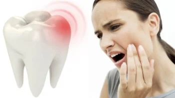 Patient experiencing tooth pain or pressure when chewing, a sign you need a dental checkup