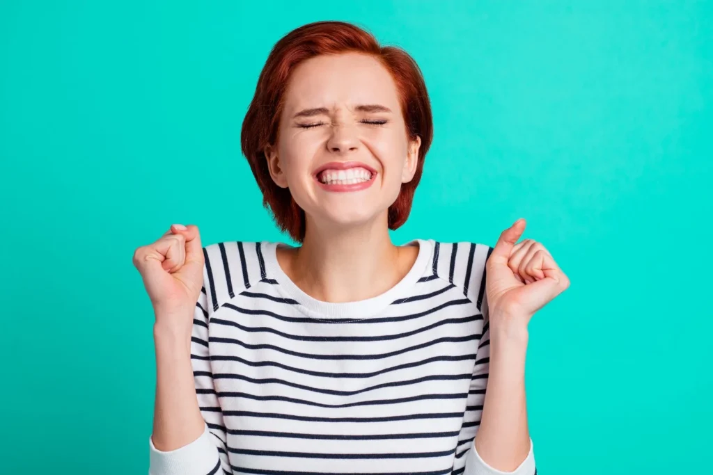 Patient smiling after treatment at cosmetic dentist Yukon OK